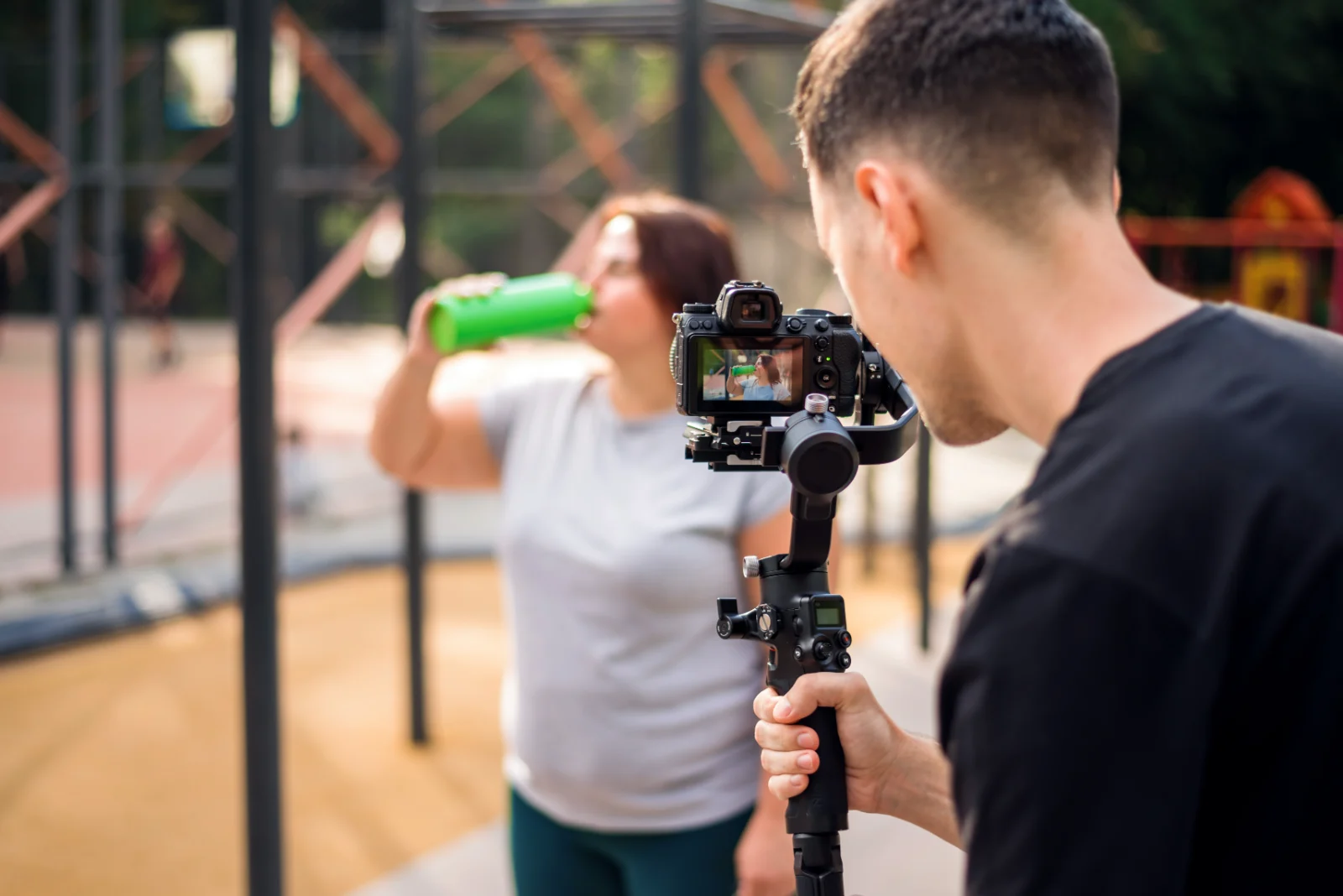 Videographer moving the camera on a gimbal stabilizer