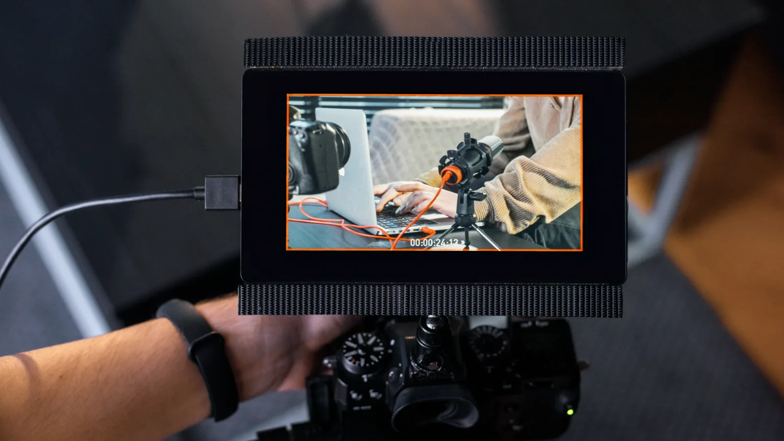 Camera with an external monitor showing how the shot is framed