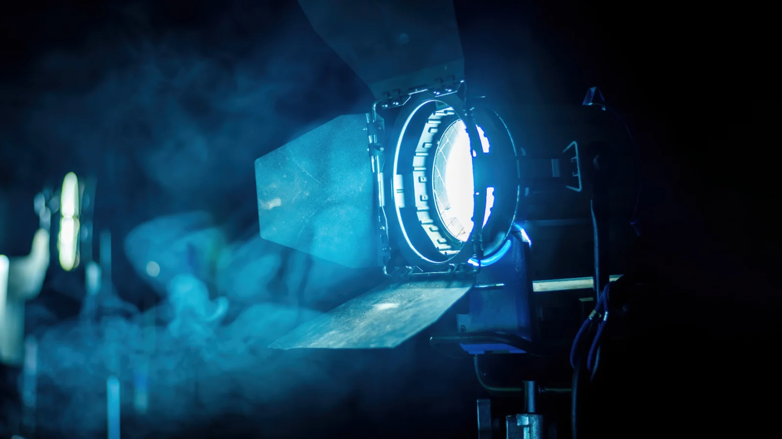 Film lights shining through haze on a movie set