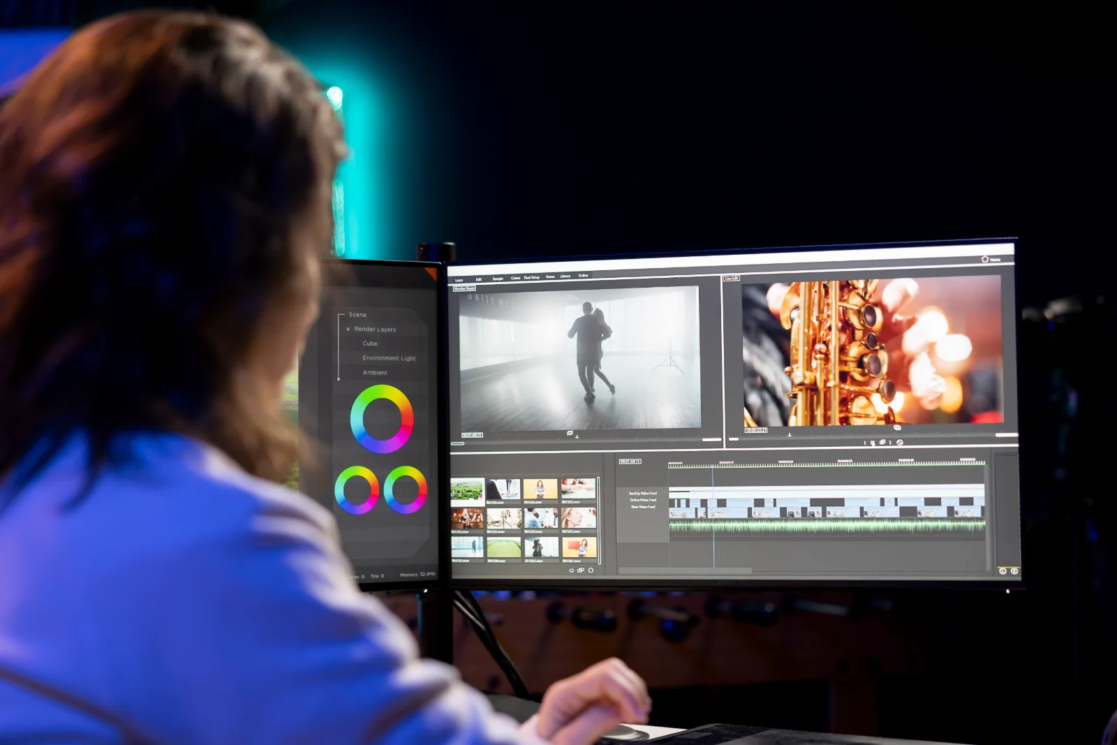 Editor color grading video footage with color wheels on screen
